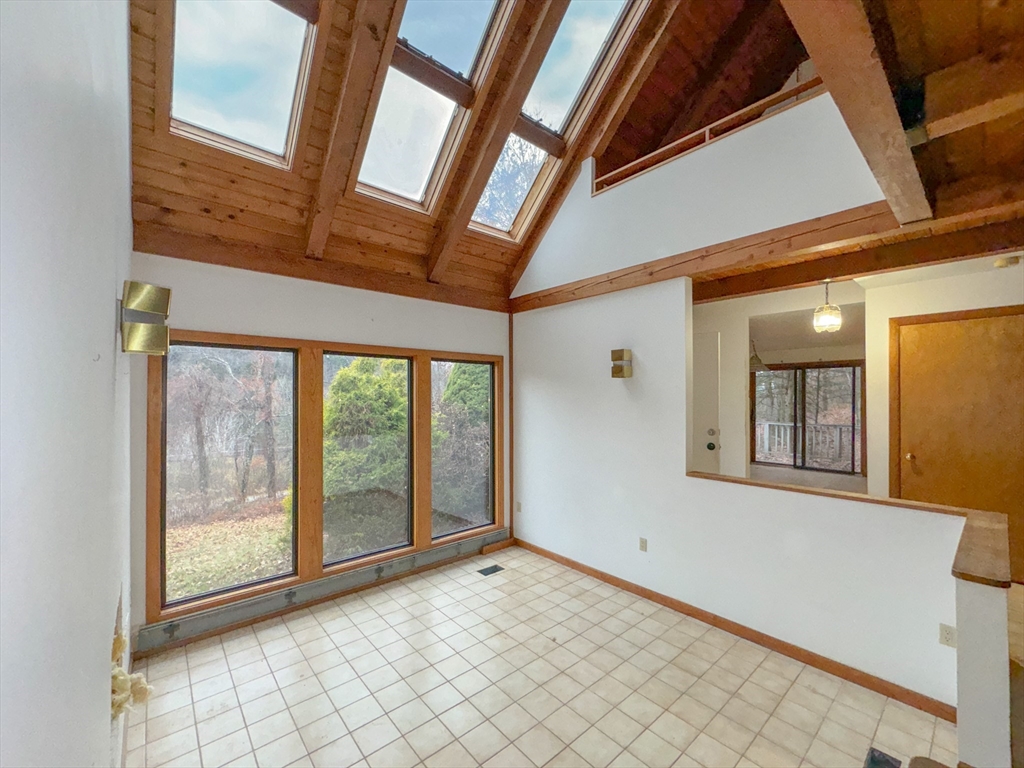 519 Kirchner Road Dalton, MA 01226 - Photo 26 of 35 a view of an empty room with wooden floor and windows