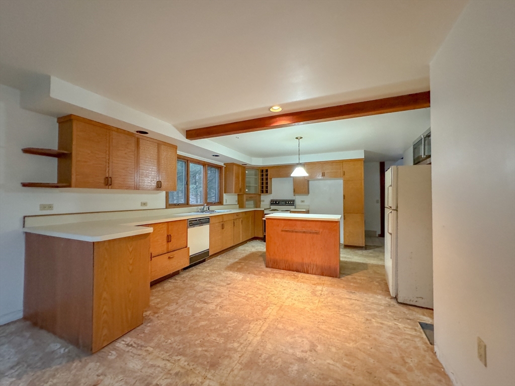 519 Kirchner Road Dalton, MA 01226 - Photo 29 of 35 a large kitchen with stainless steel appliances wooden cabinets and a sink