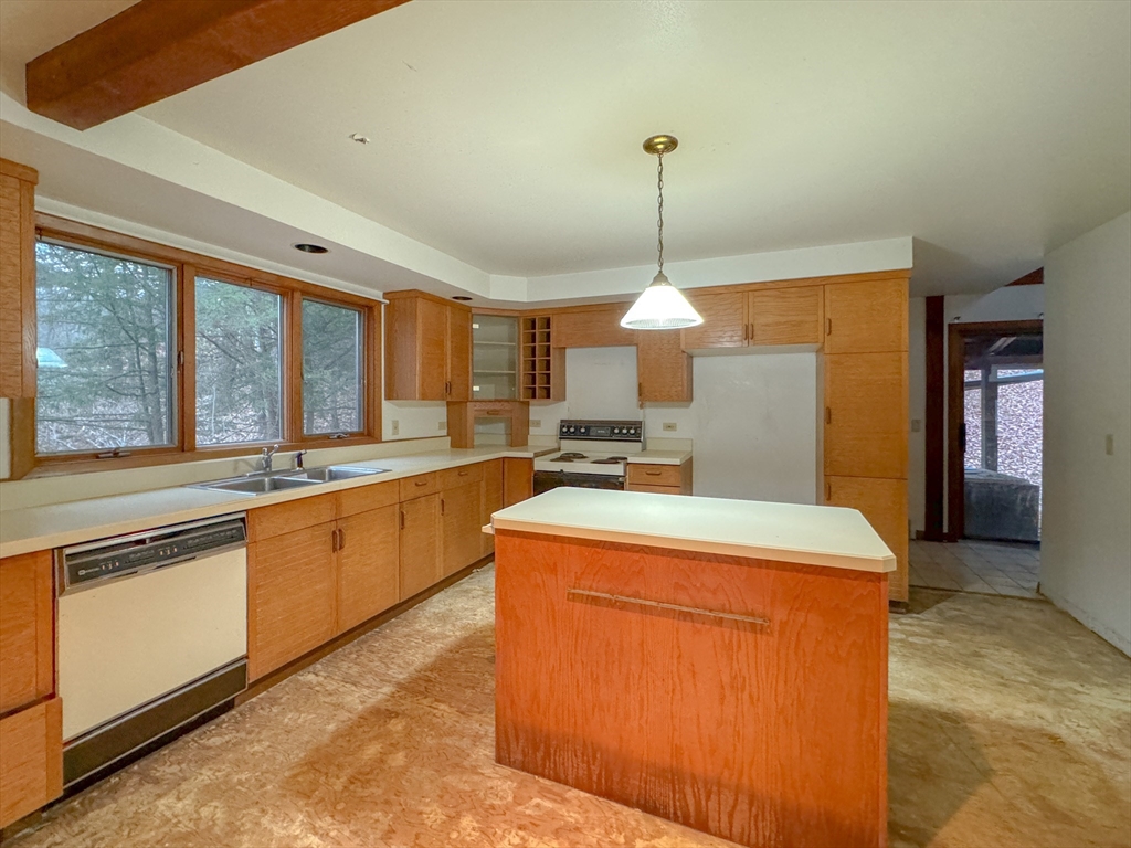 519 Kirchner Road Dalton, MA 01226 - Photo 31 of 35 a kitchen with stainless steel appliances granite countertop a sink a stove and a refrigerator