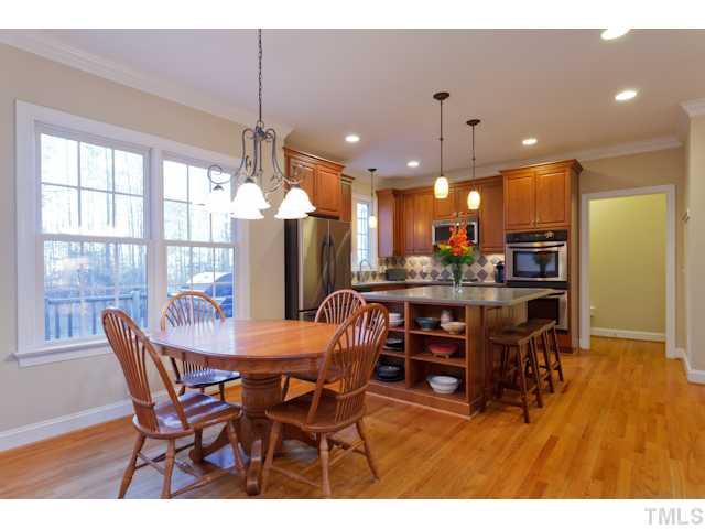 7613 Double E Court Raleigh, NC 27613 - Photo 5 of 23 Large Breakfast Room is open to large Kitchen & Family Room. Fantastic view of the Private Back Yard. Breakfast Area