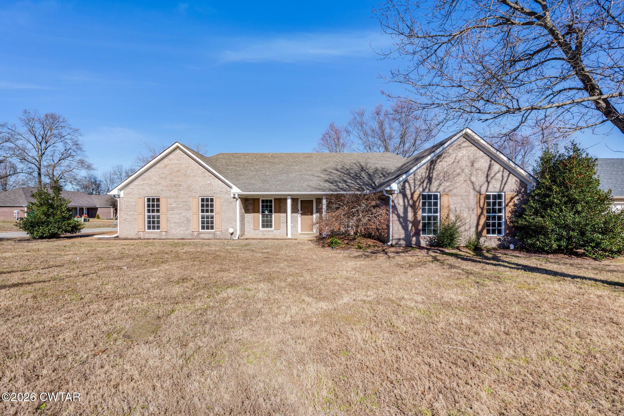 75 Suncrest Drive Jackson, TN 38305 - Photo 1 of 24 a view of a house with a yard
