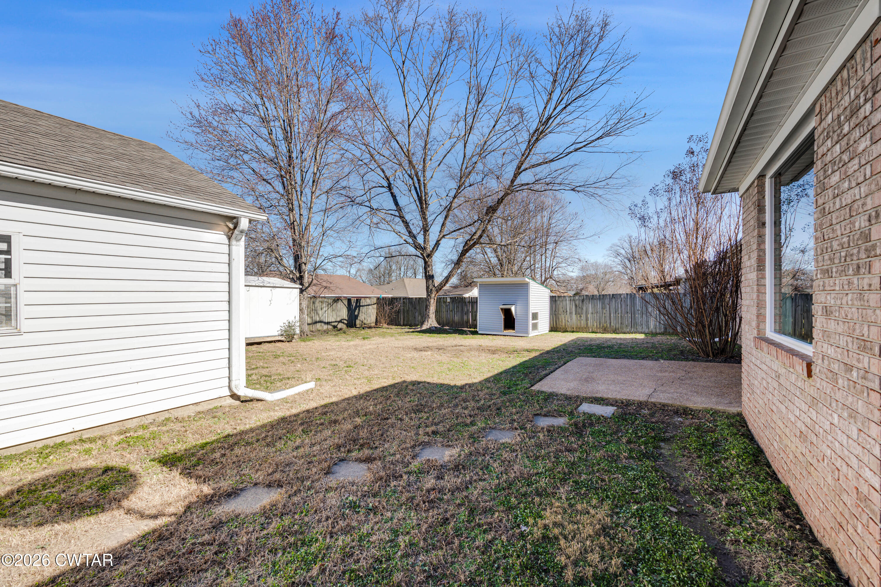 75 Suncrest Drive Jackson, TN 38305 - Photo 12 of 24 a view of a yard with a house