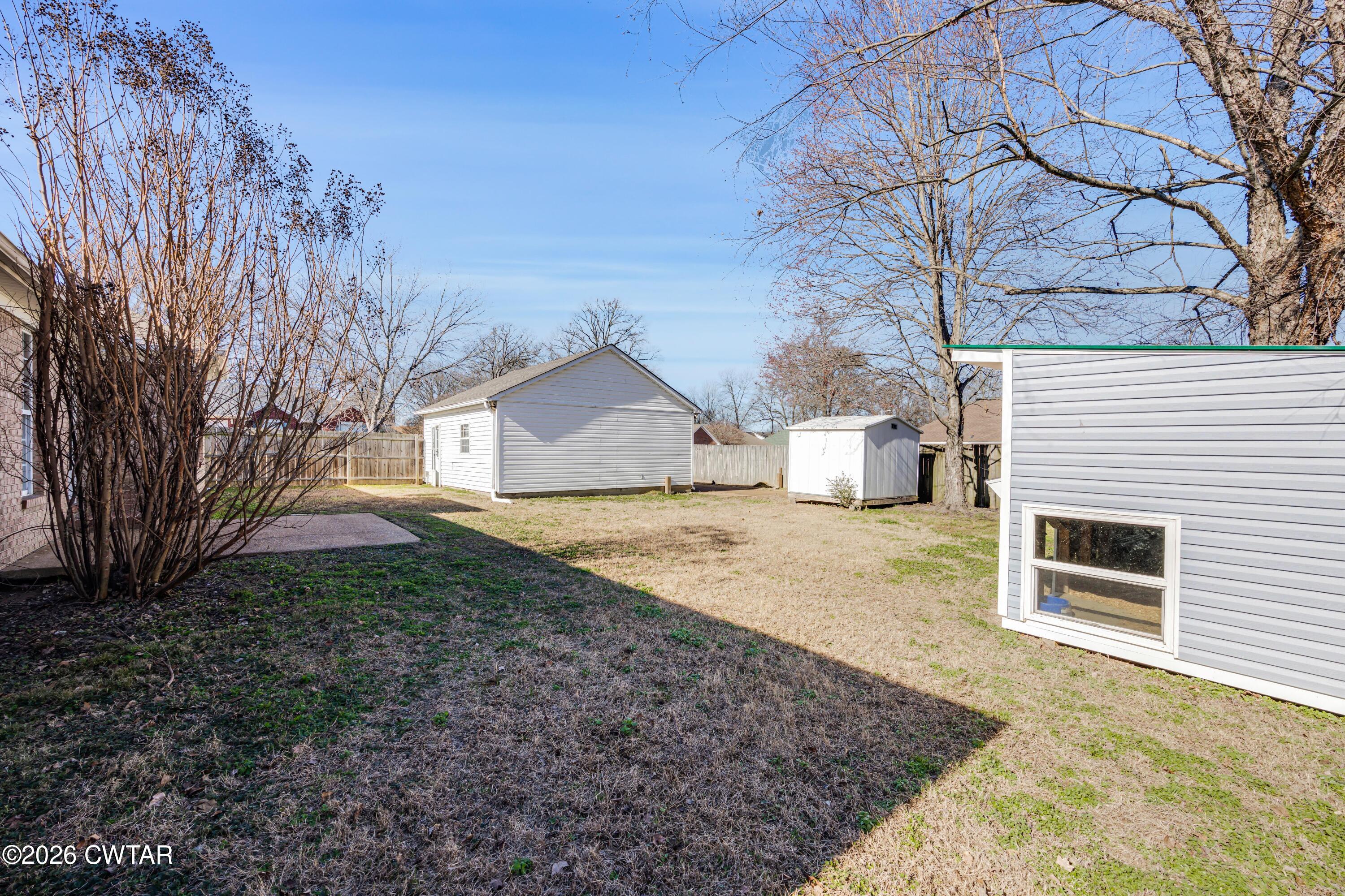75 Suncrest Drive Jackson, TN 38305 - Photo 13 of 24 a house view with a backyard space
