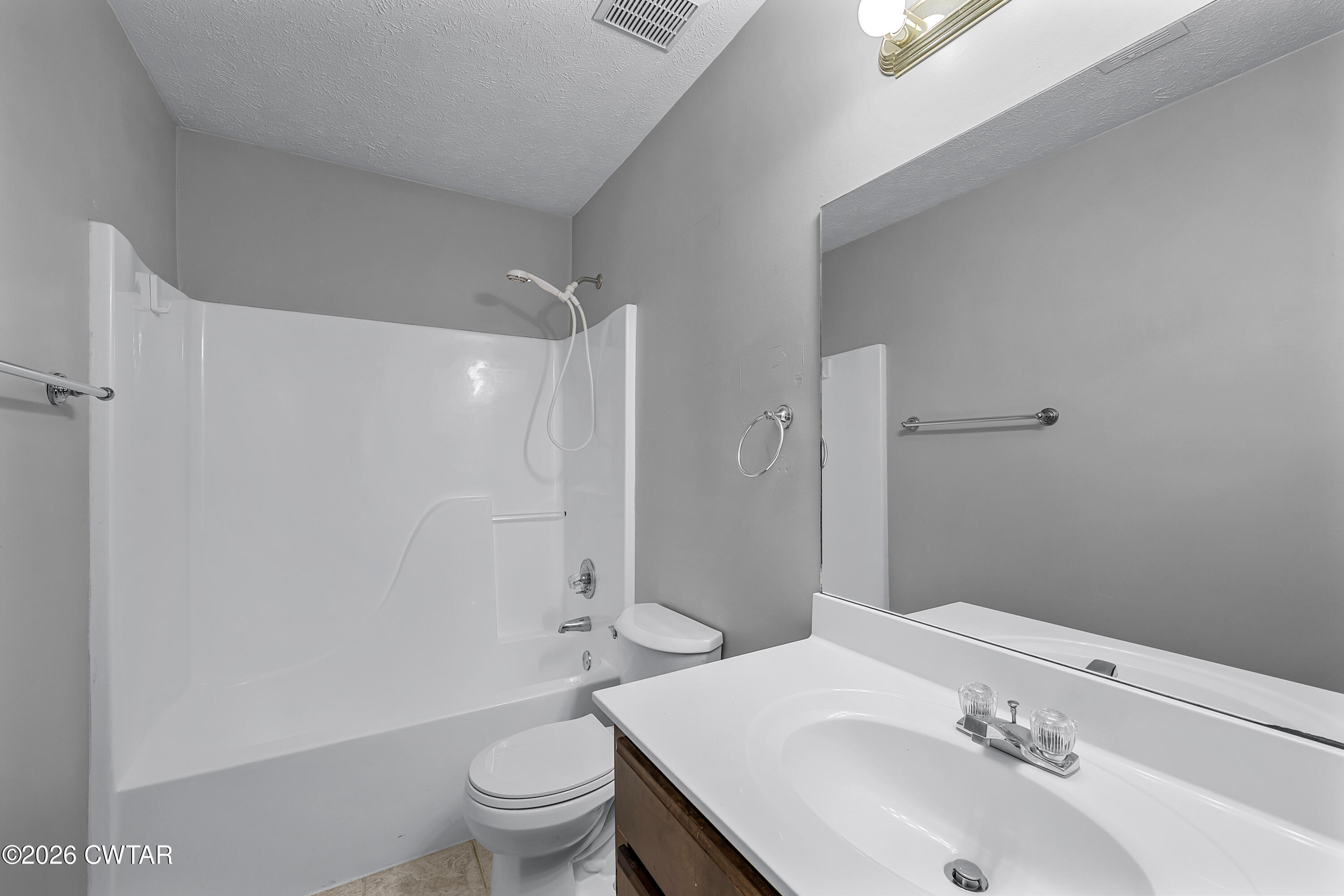 75 Suncrest Drive Jackson, TN 38305 - Photo 16 of 24 a bathroom with a sink and a toilet