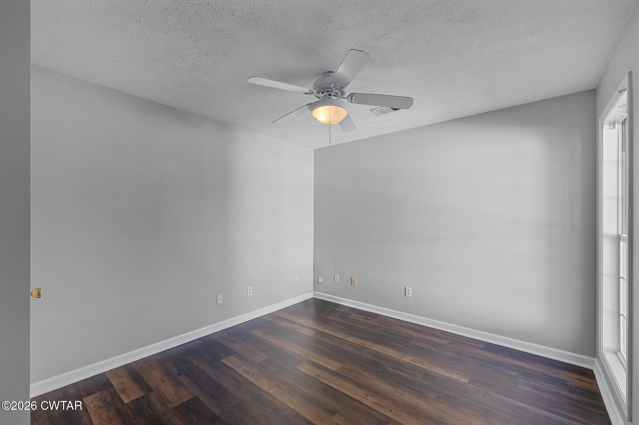 75 Suncrest Drive Jackson, TN 38305 - Photo 21 of 24 a view of empty room with wooden floor