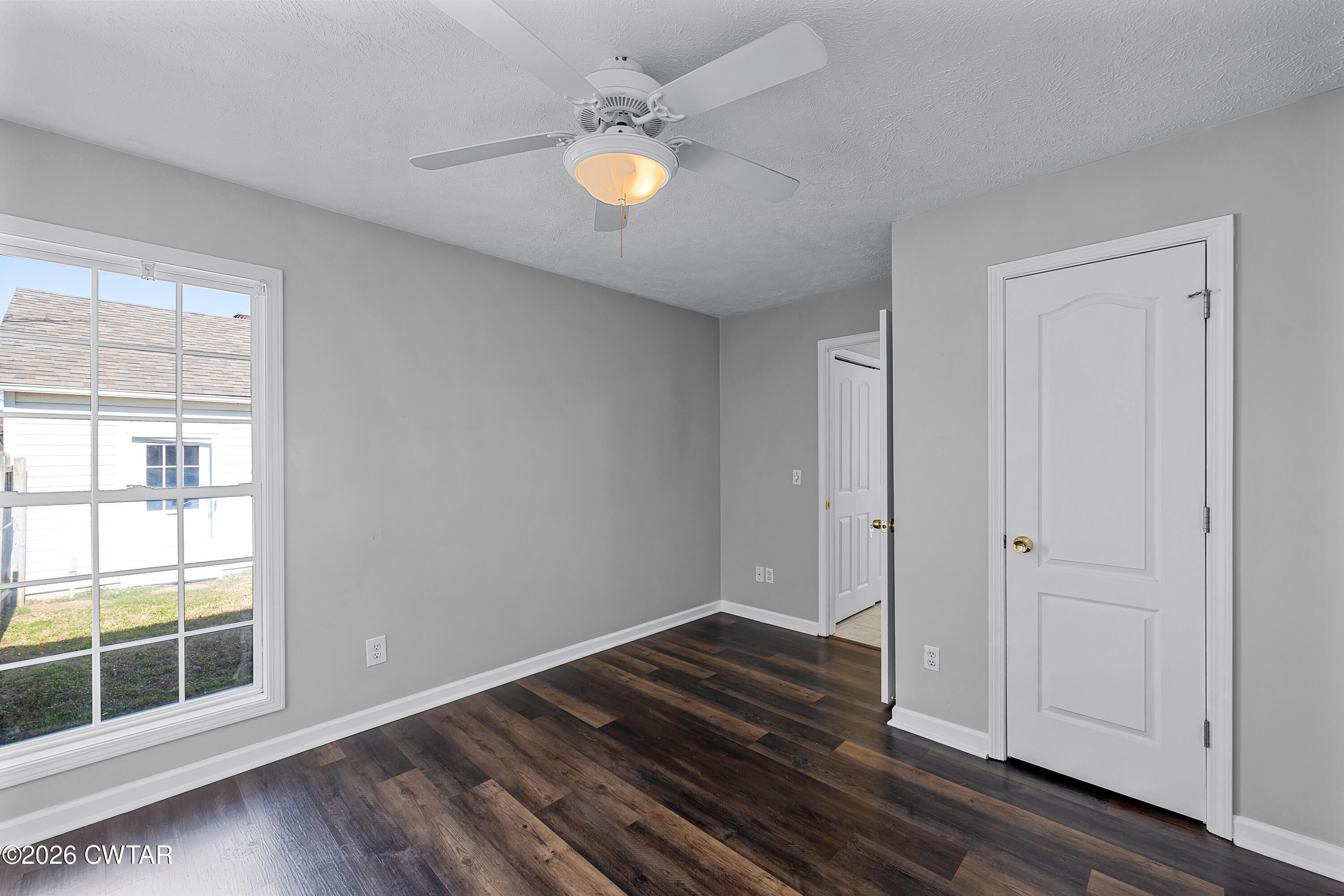 75 Suncrest Drive Jackson, TN 38305 - Photo 22 of 24 a view of wooden floor and windows in a room