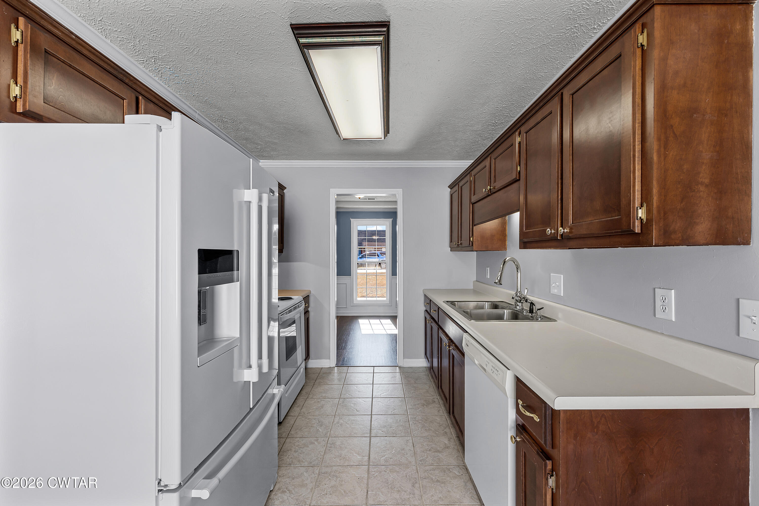 75 Suncrest Drive Jackson, TN 38305 - Photo 6 of 24 a kitchen with a sink stove and refrigerator