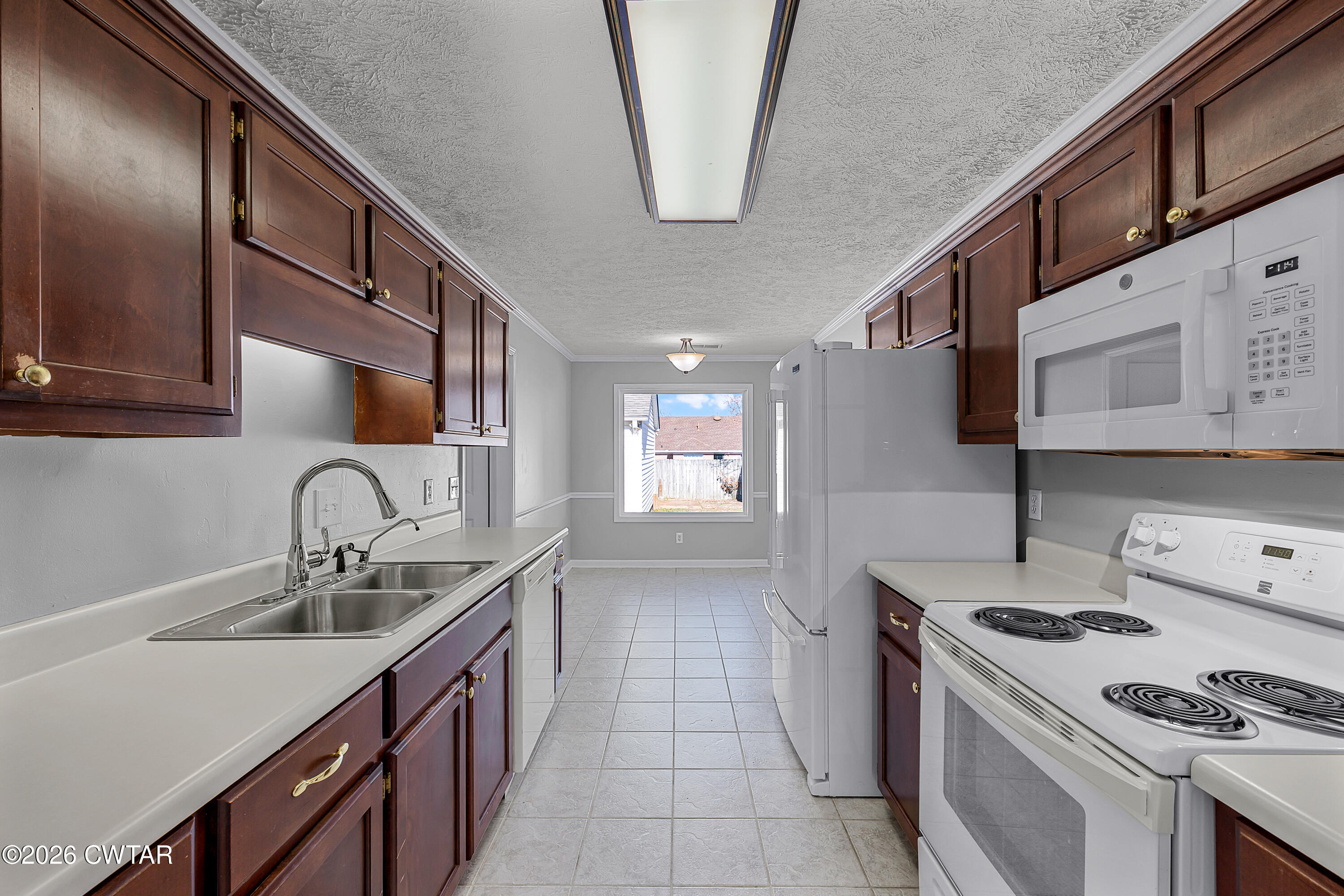 75 Suncrest Drive Jackson, TN 38305 - Photo 8 of 24 a kitchen with stainless steel appliances a sink stove and cabinets