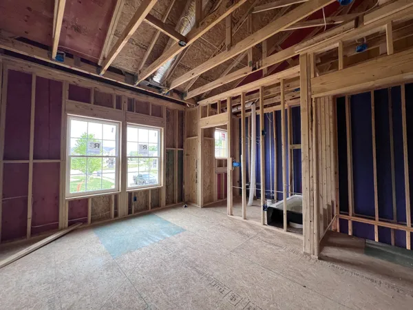 a view of an empty room with a fireplace