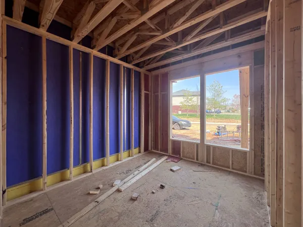 a view of an empty room with windows