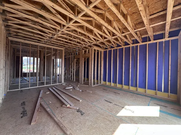 a view of an empty room with wooden walls