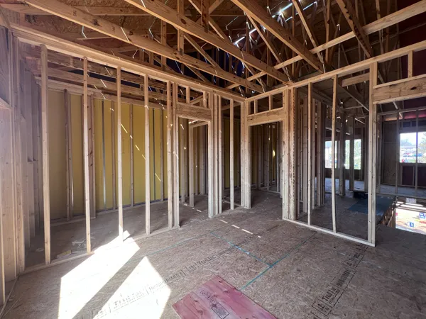 a view of an empty room with a fireplace