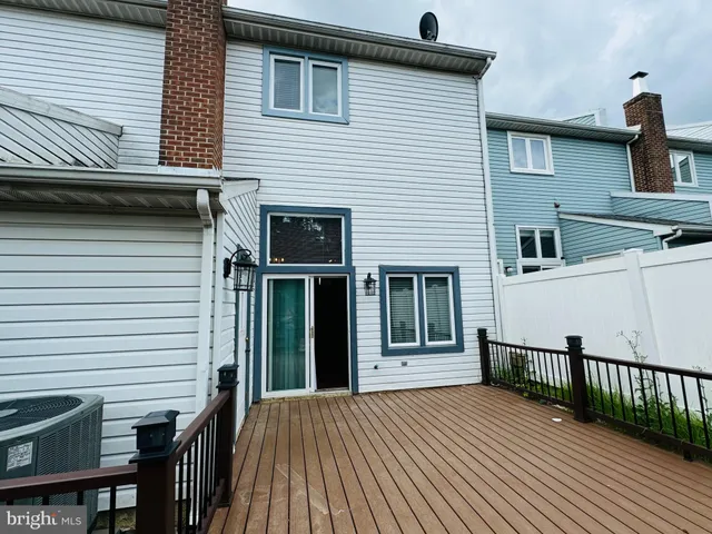 a view of a house with wooden deck