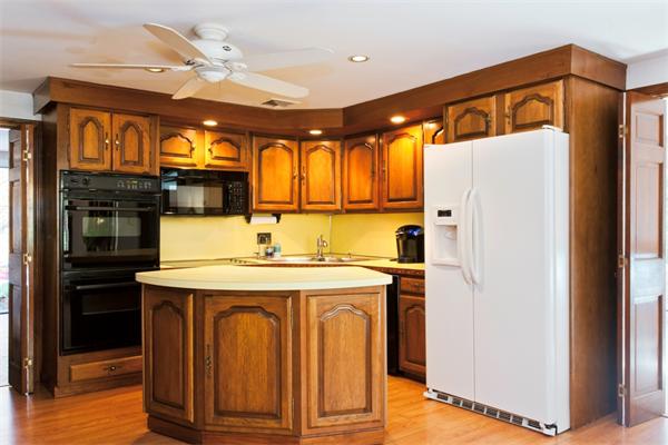 135 Albemarle Road Newton, MA 02460 - Photo 2 of 6 a kitchen with stainless steel appliances granite countertop a refrigerator and a stove