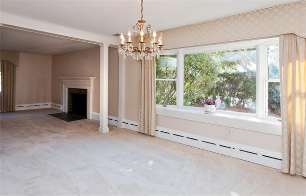 135 Albemarle Road Newton, MA 02460 - Photo 5 of 6 wooden floor with chandelier and fireplace