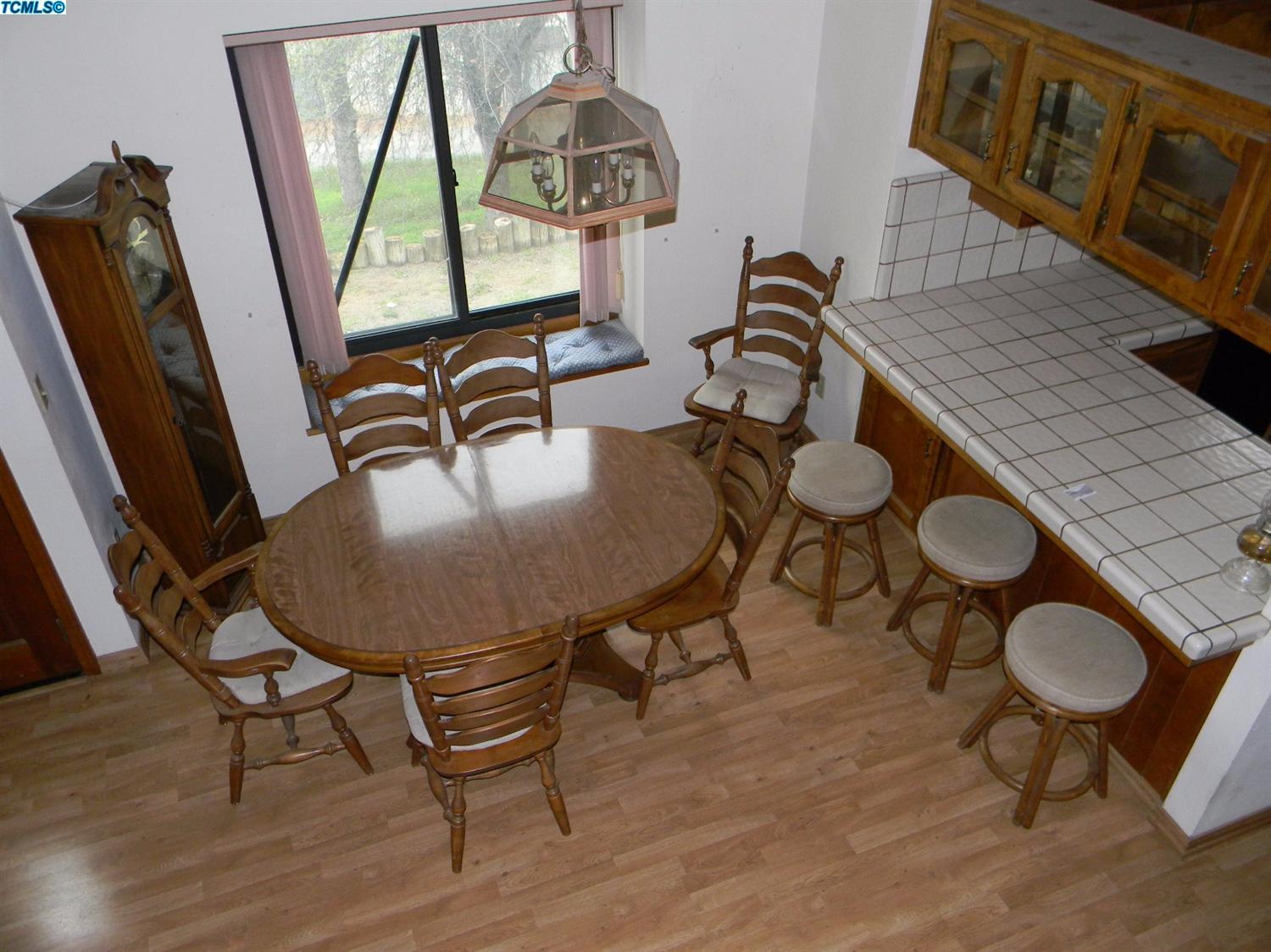 40675 Crystal Drive Three Rivers, CA 93271 - Photo 17 of 34 a view of a dining room with furniture window and wooden floor