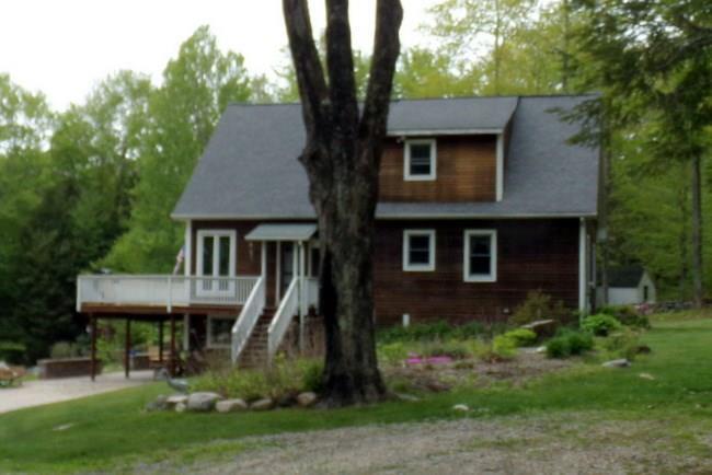 27 Prock Hill Road Colebrook, CT 06021 - Photo 1 of 1 a front view of a house with garden