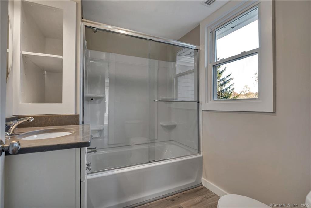 368 Boston Street Guilford, CT 06437 - Photo 11 of 24 a bathroom with a tub and a sink