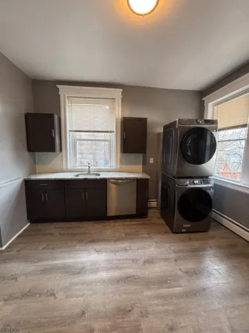a kitchen with a cabinets and a window