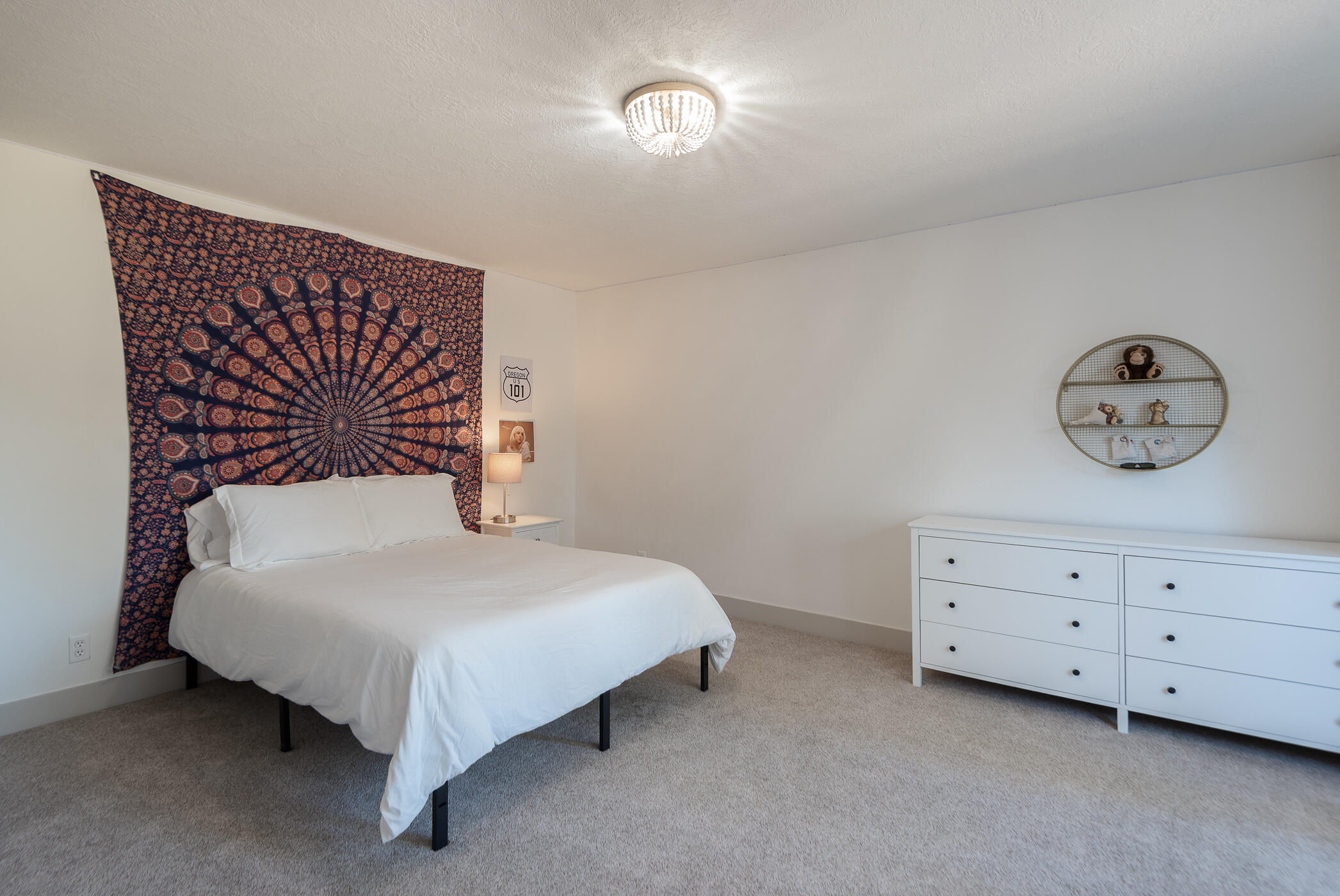 60012 West Ridgeview Drive Bend, OR 97702 - Photo 22 of 55 a bedroom with a bed and cabinet