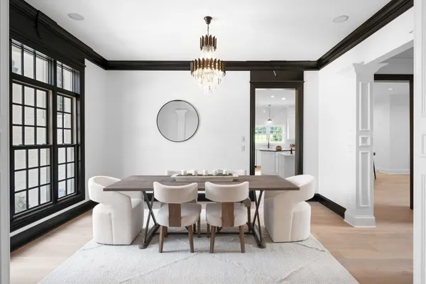a view of living room with furniture and wooden floor
