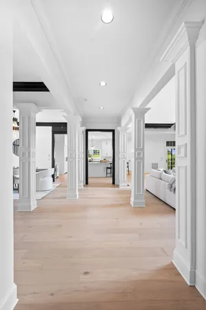 a kitchen with a stove and white cabinets