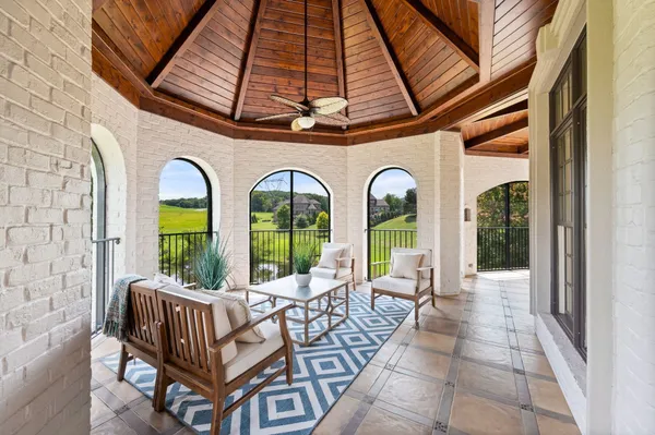 a bathroom with a sink vanity tub and a mirror