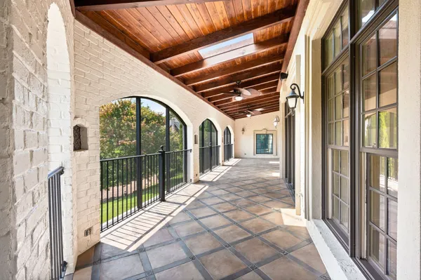 a bathroom with a granite countertop sink and a bathtub