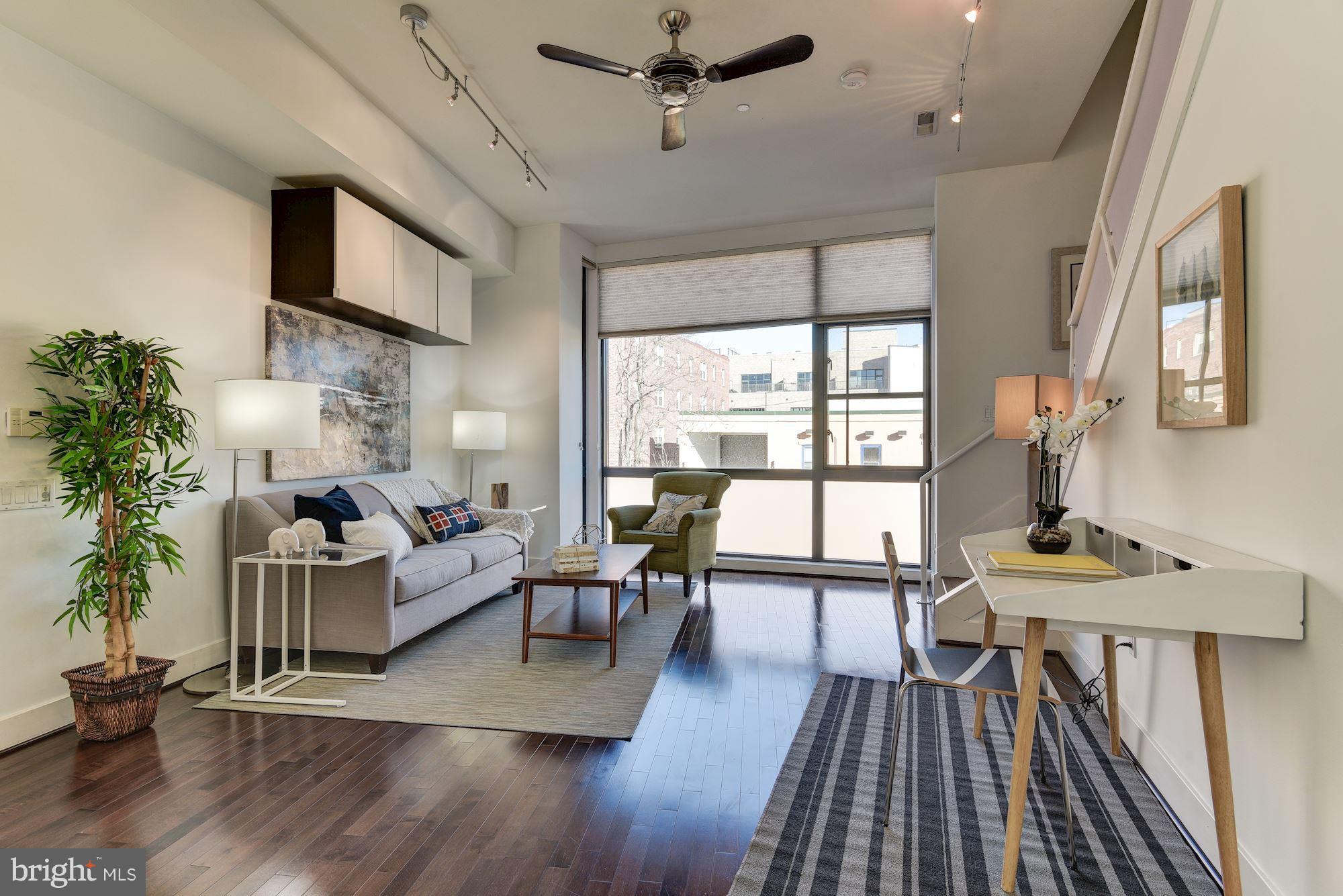 2426 Ontario Road Northwest, Unit 304 Washington, DC 20009 - Photo 6 of 30 Living Room--Floor to ceiling windows