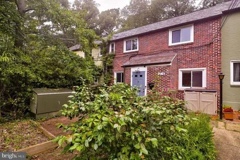 a view of a house with a flower garden