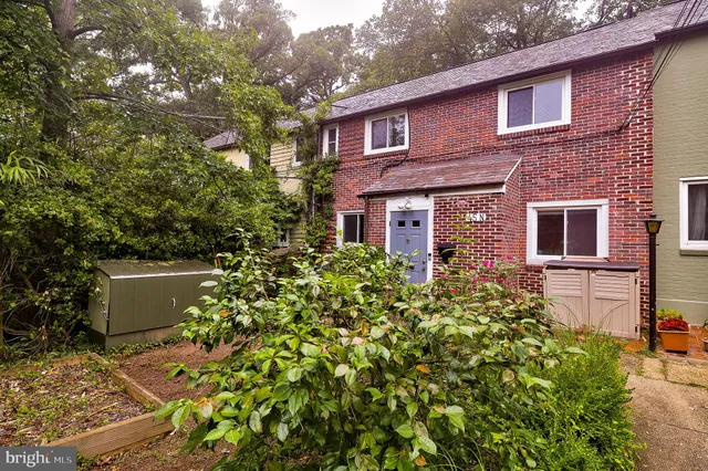 a view of a house with a flower garden