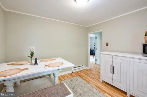 a room with a table and chairs