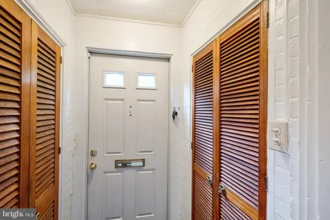 a view of a hallway with front door