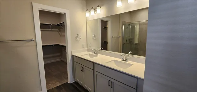 an empty room with a ceiling fan and a window