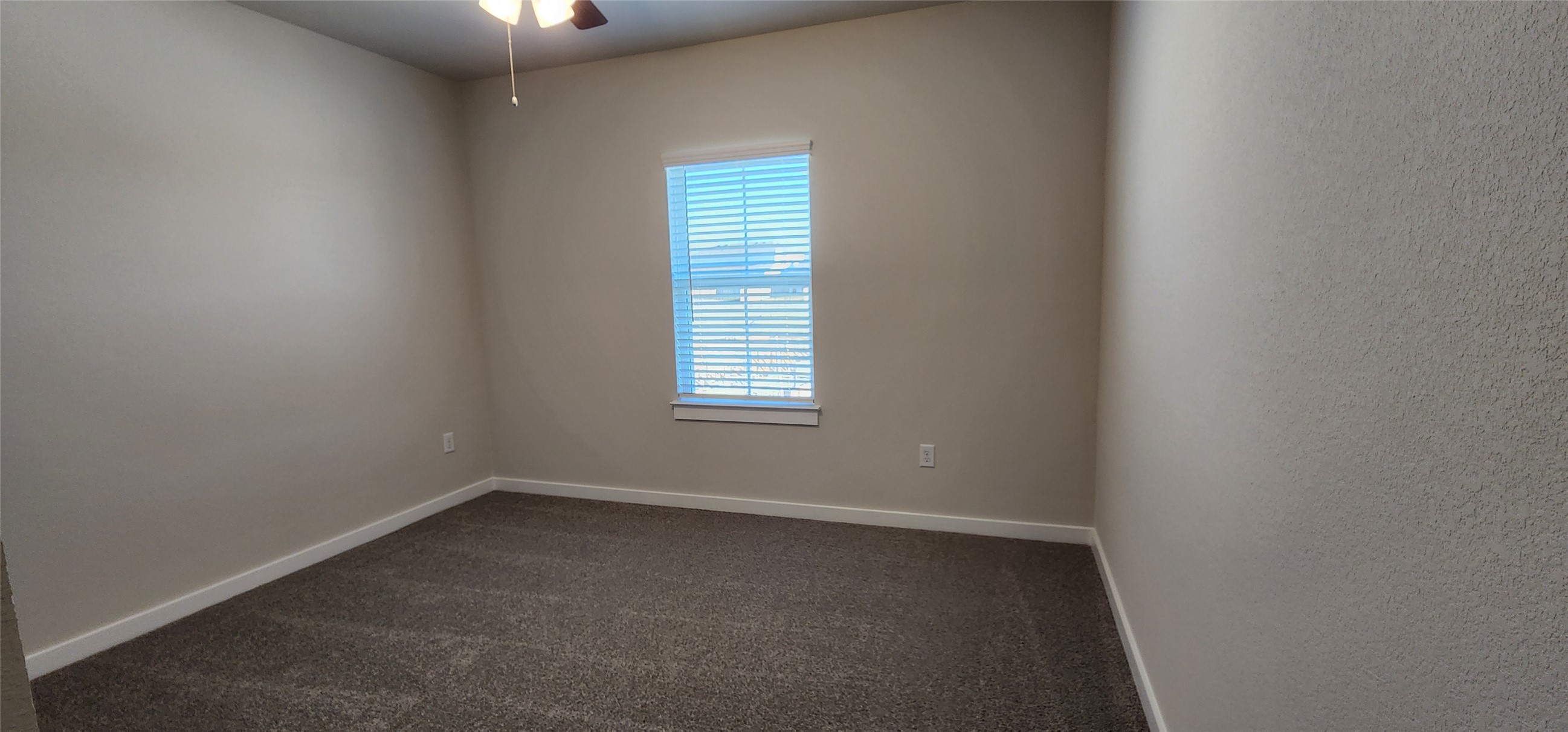 2240 Delano Drive Leander, TX 78641 - Photo 21 of 32 Spare room with dark carpet and ceiling fan