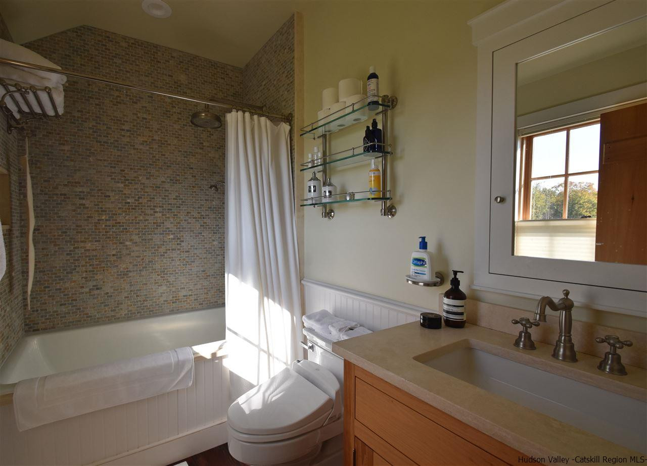 555 Milan Hill Road Red Hook, NY 12571 - Photo 23 of 29 a bathroom with a granite countertop sink toilet and shower