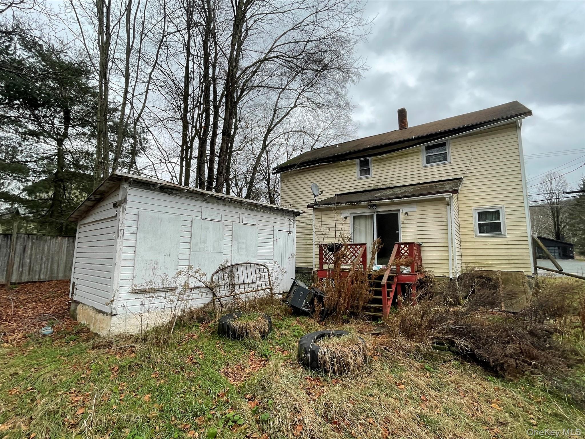 865 North Branch Road Callicoon, NY 12766 - Photo 13 of 15 Rear view of house with a chimney and an outbuilding