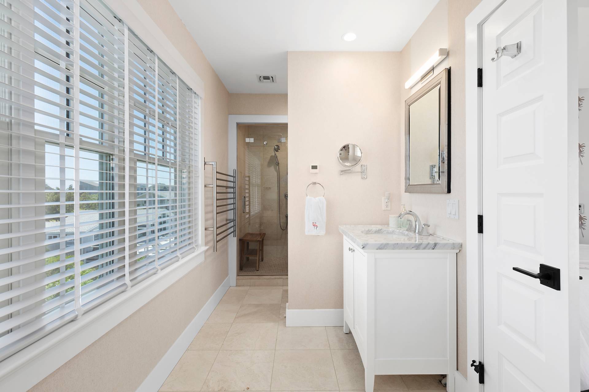650 Dune Road Westhampton, NY 11978 - Photo 11 of 22 a bathroom with a granite countertop sink a toilet and shower