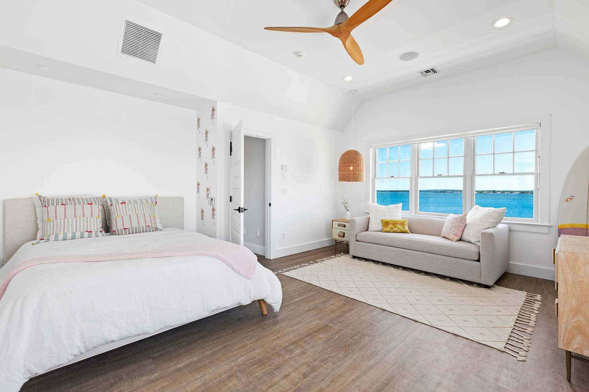 650 Dune Road Westhampton, NY 11978 - Photo 14 of 22 a bedroom with a large bed couch and windows