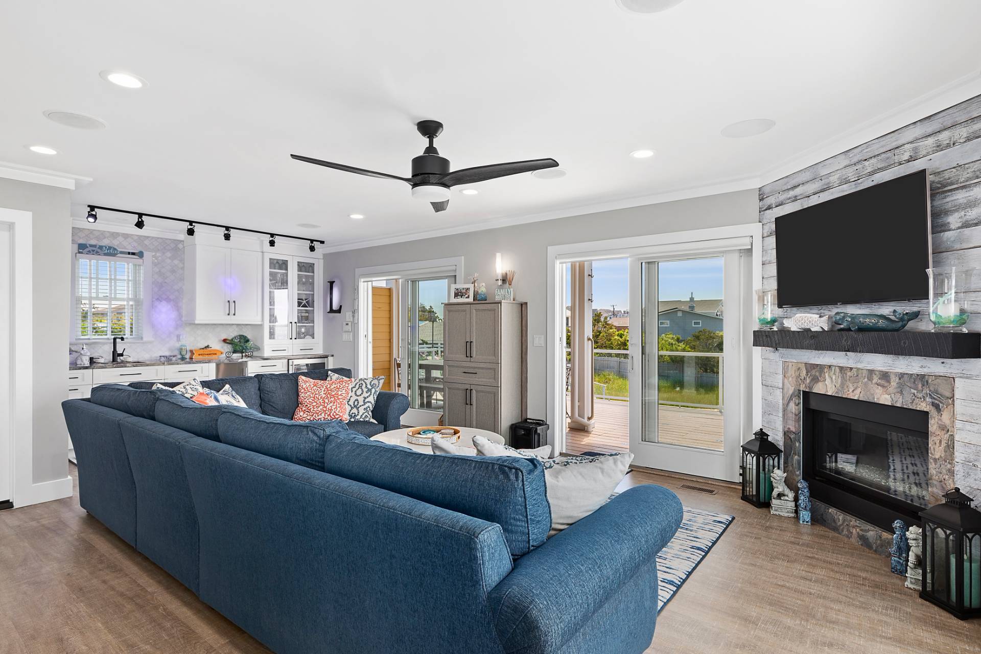 650 Dune Road Westhampton, NY 11978 - Photo 16 of 22 a living room with furniture a fireplace and a flat screen tv