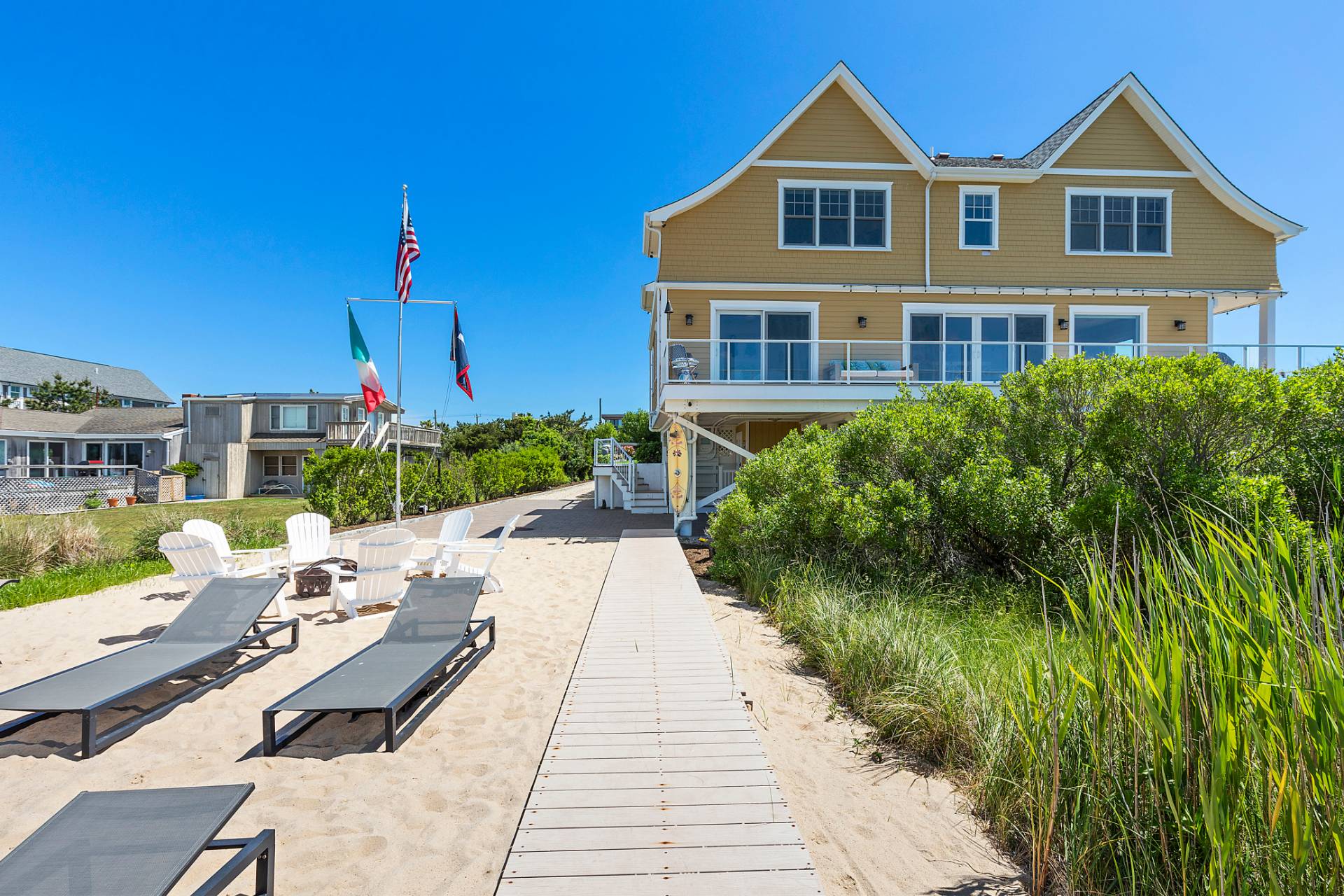 650 Dune Road Westhampton, NY 11978 - Photo 18 of 22 a front view of a house with a yard