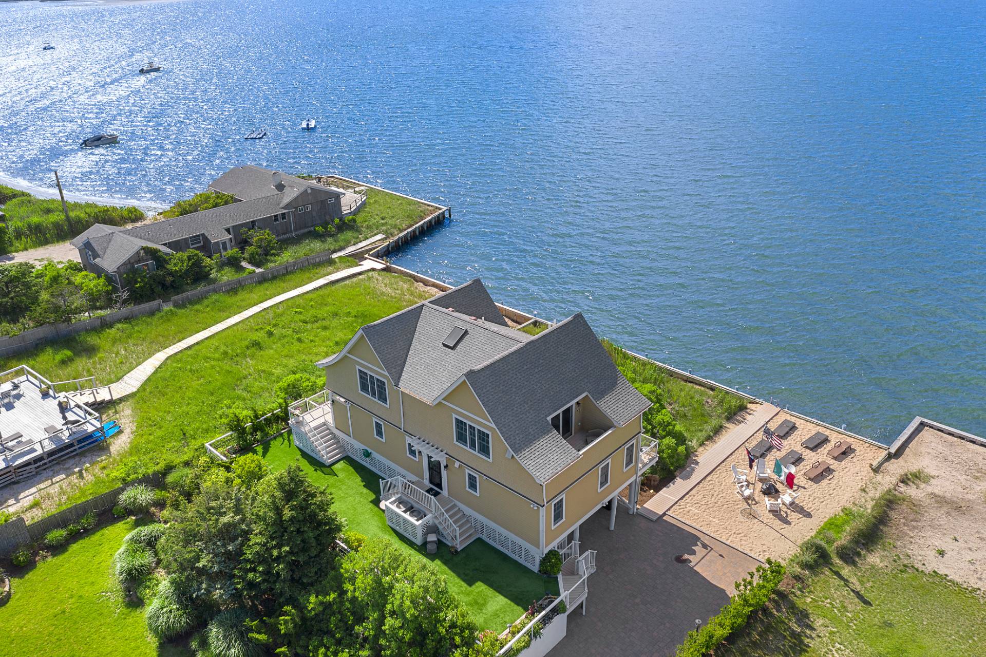 650 Dune Road Westhampton, NY 11978 - Photo 20 of 22 an aerial view of a house with a garden and swimming pool