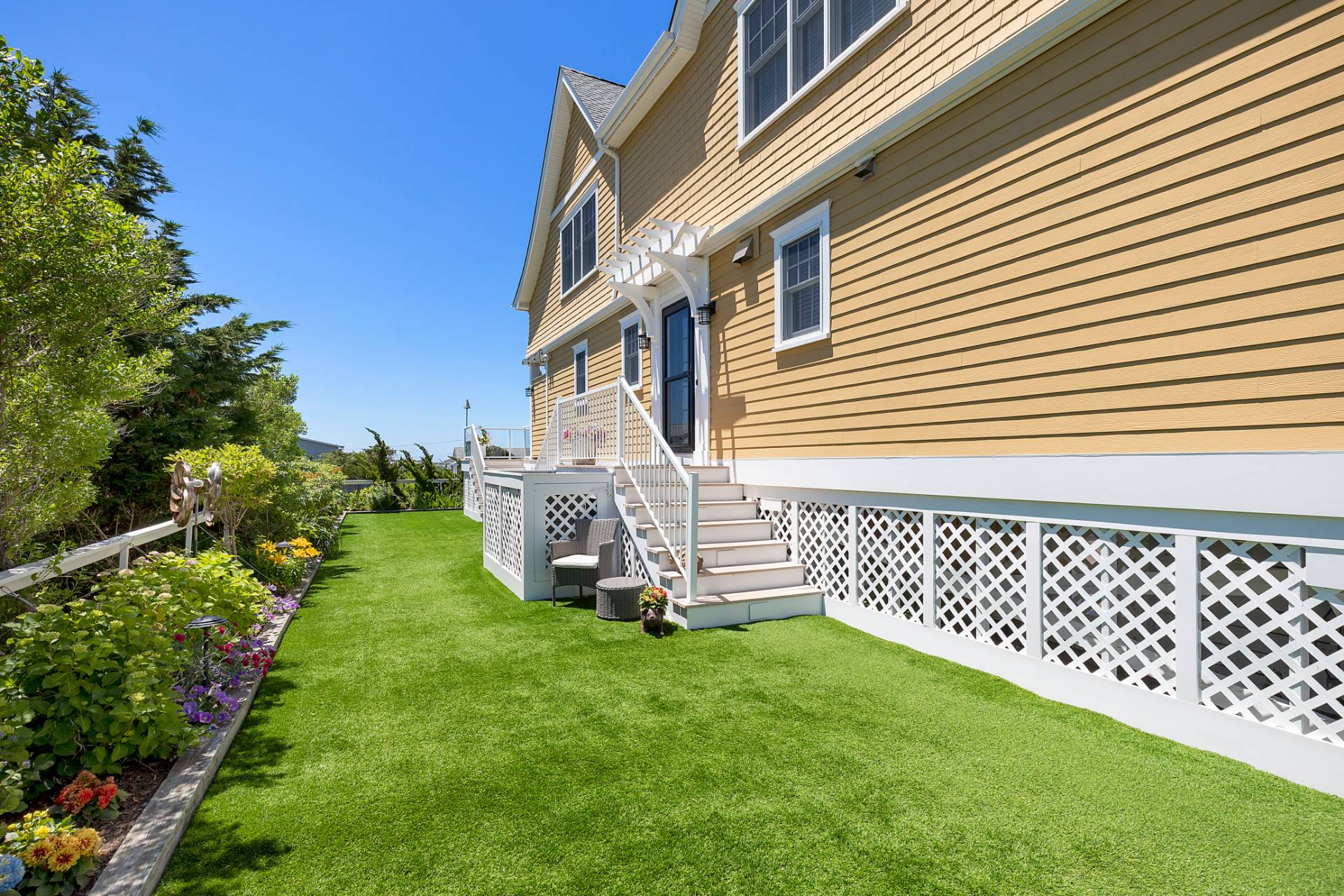 650 Dune Road Westhampton, NY 11978 - Photo 3 of 22 a view of a house with a yard