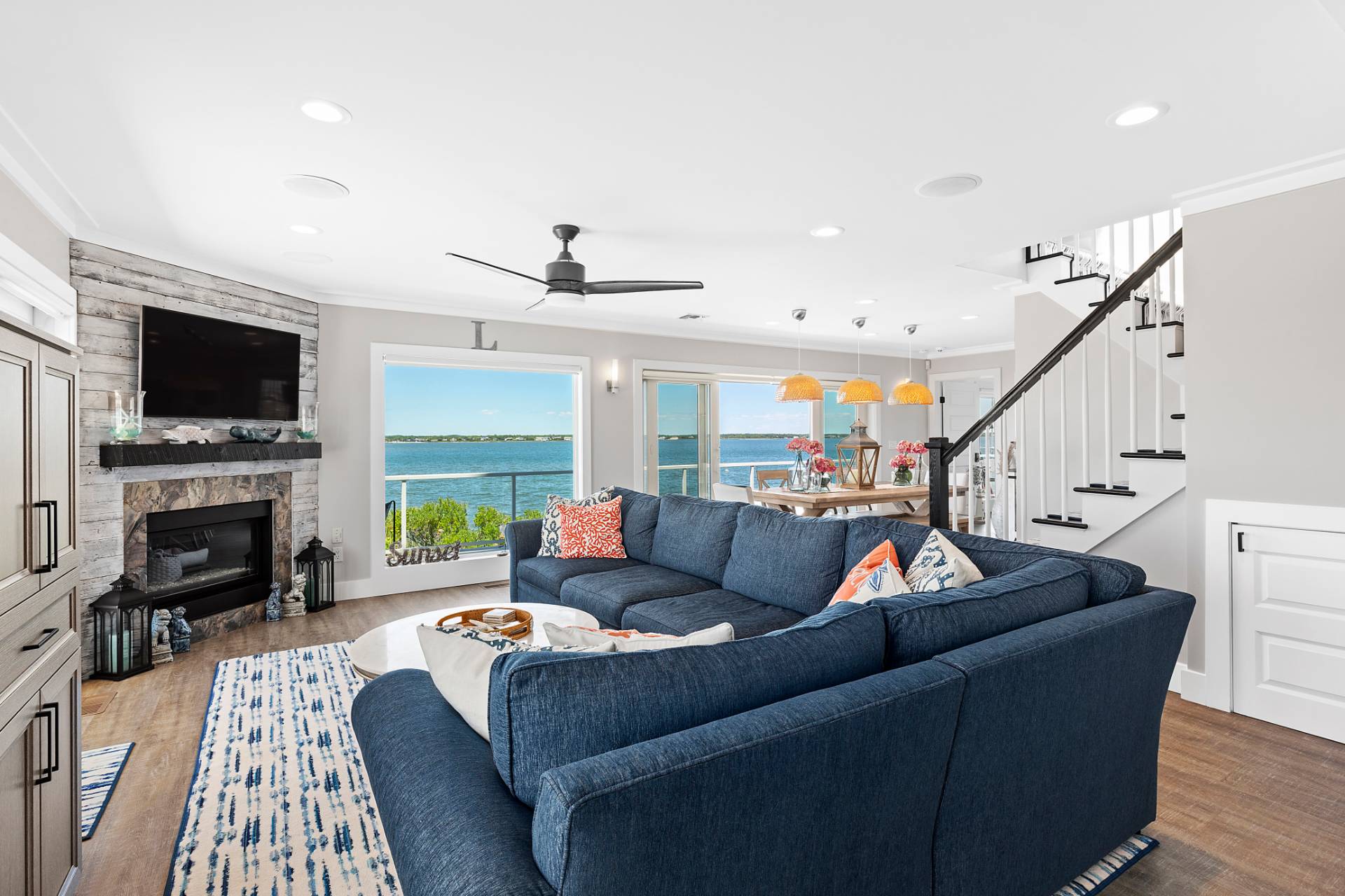 650 Dune Road Westhampton, NY 11978 - Photo 7 of 22 a living room with fireplace furniture and a flat screen tv