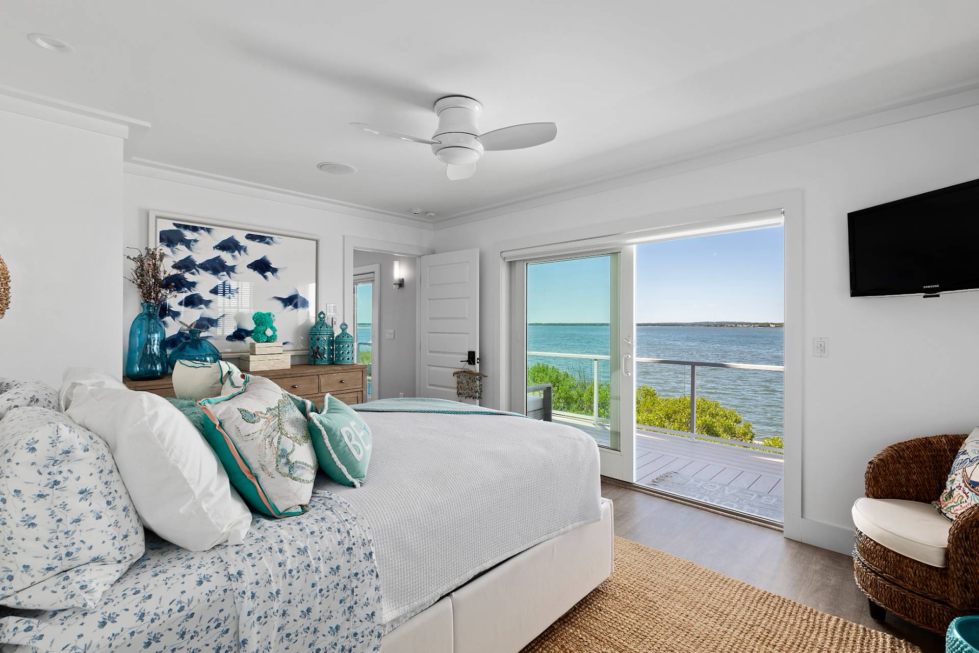 650 Dune Road Westhampton, NY 11978 - Photo 8 of 22 a bedroom with furniture and a large window