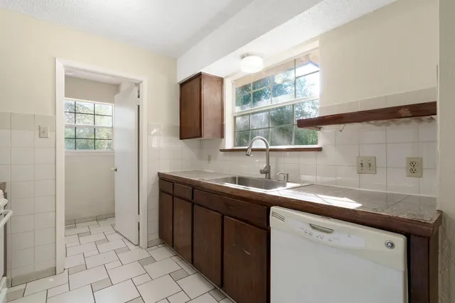a kitchen with a sink and a cabinets