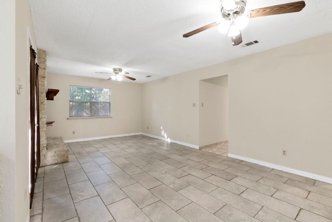 7703 Peaceful Hill Lane, Unit B Austin, TX 78745 - Photo 6 of 22 a view of an empty room with a window