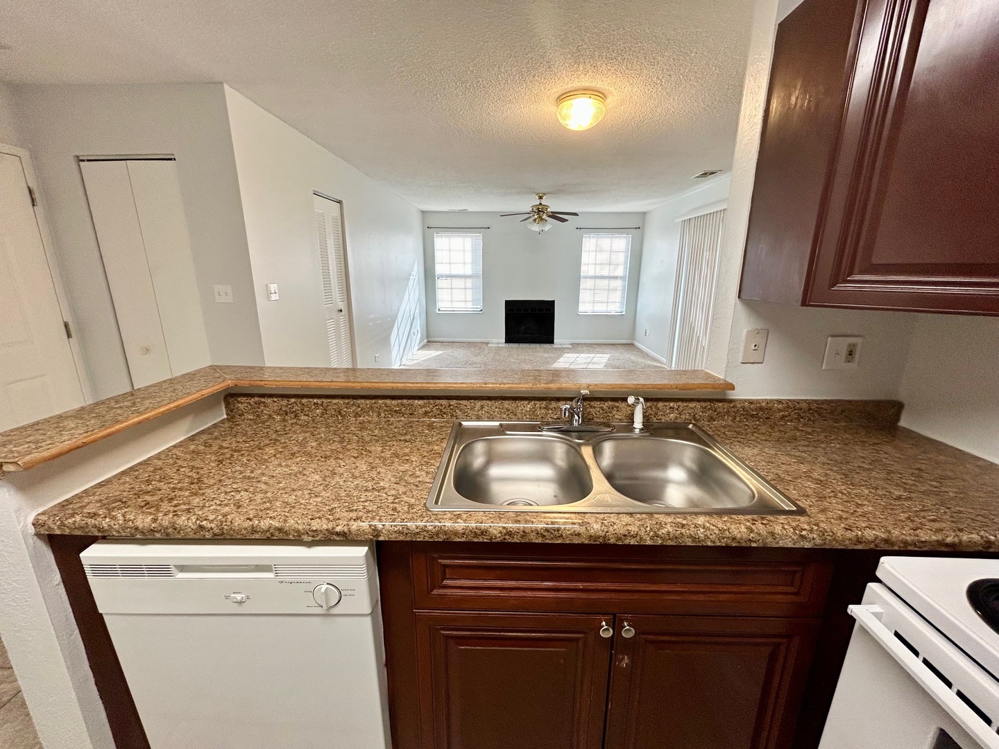 2068 North Rand Road, Unit 109 Palatine, IL 60074 - Photo 3 of 9 a kitchen with granite countertop stainless steel appliances granite countertop a sink stove and cabinets
