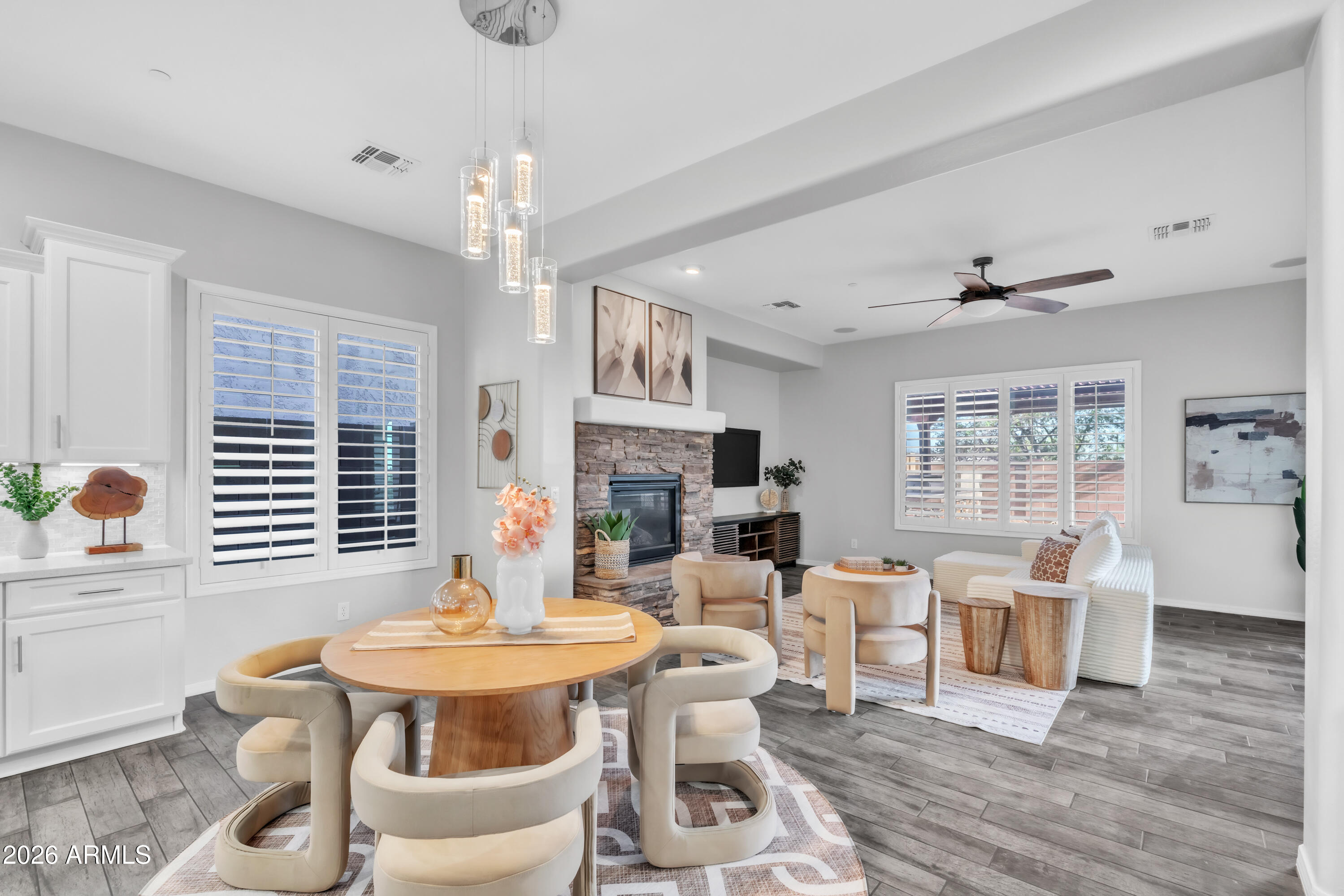 1615 West Red Fox Road Phoenix, AZ 85085 - Photo 20 of 64 a view of a dining room with furniture window and wooden floor