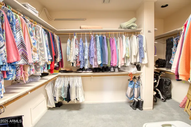 a spacious bathroom with a double vanity sink and mirror